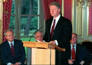 President Clinton speaks after the signing of the Balkan peace treaty at the Elysee Palace in Paris, Thursday December 14, 1995. Looking on seated from left are Serbian President Slobodan Milosevic, Croatian President Franjo Tudjman, and Bosnian President Alija Izetbegovic. Bosnia's chiefs on Thursday signed a peace deal which formally ends the worst bloodshed in Europe since World War II. Clinton called it the day that turned the shattered country ``from the horror of war to the promise of peace.''(APPhoto/Michel Gangne/pool)